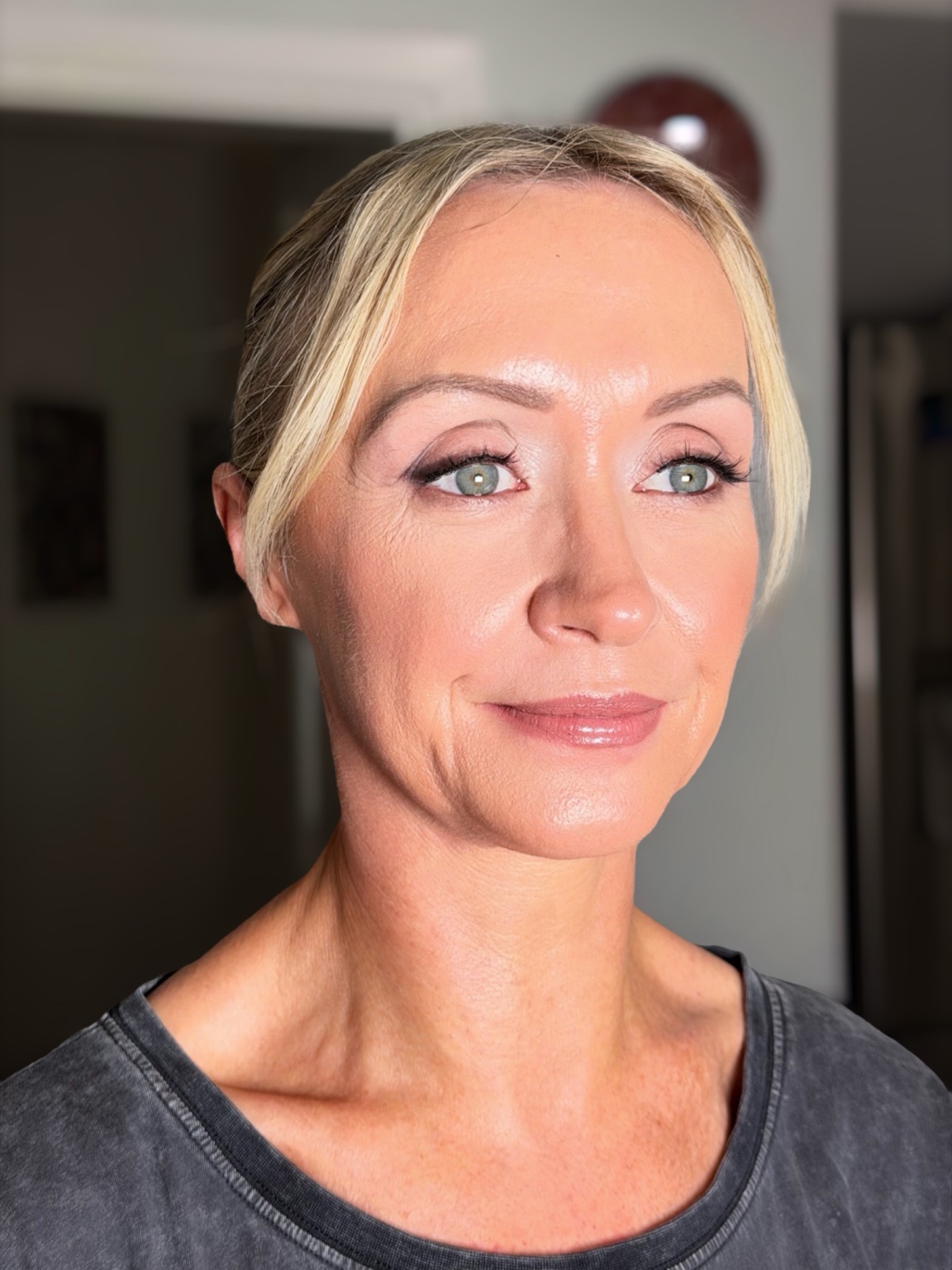Makeup on mature skin with softly defined eyes and a pink lip